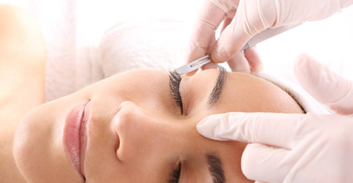 lady with beautiful lashes getting exfoliating dermaplaning at Me Time Botanicals Day Spa