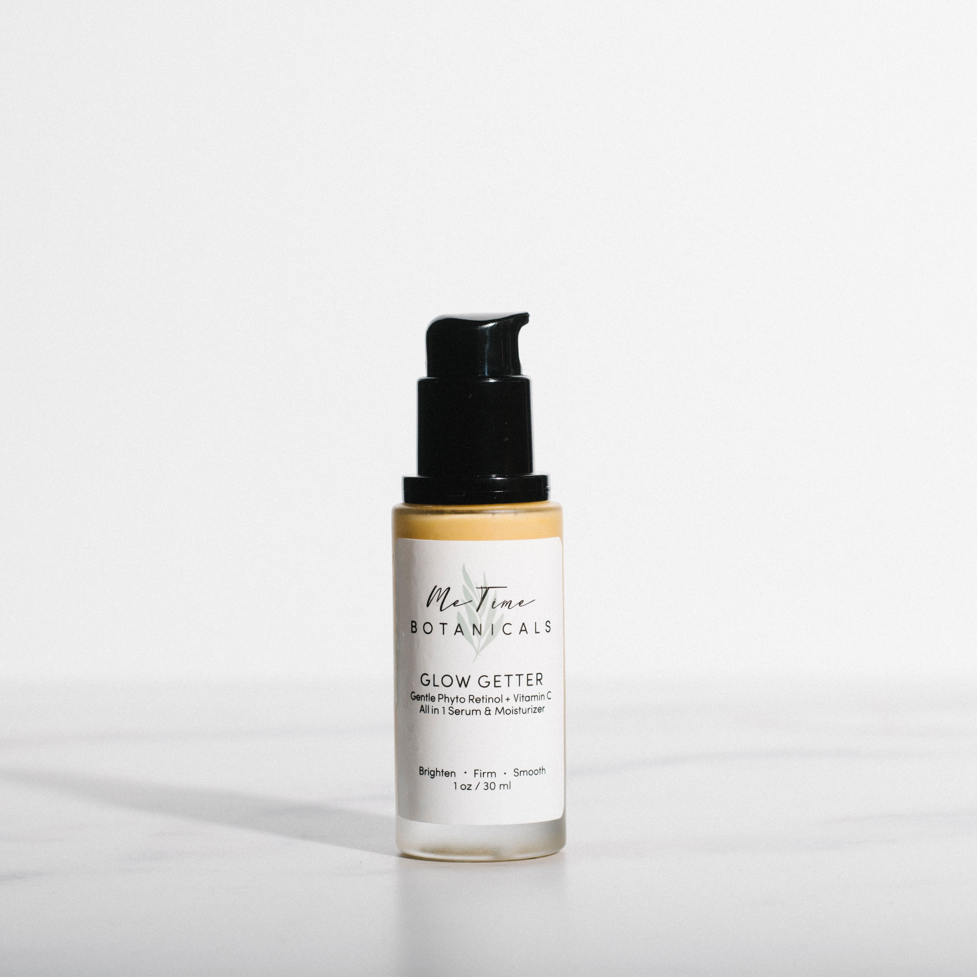 Skincare bottle labeled 'Glow Getter' on a white background