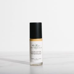 Skincare bottle labeled 'Glow Getter' on a white background