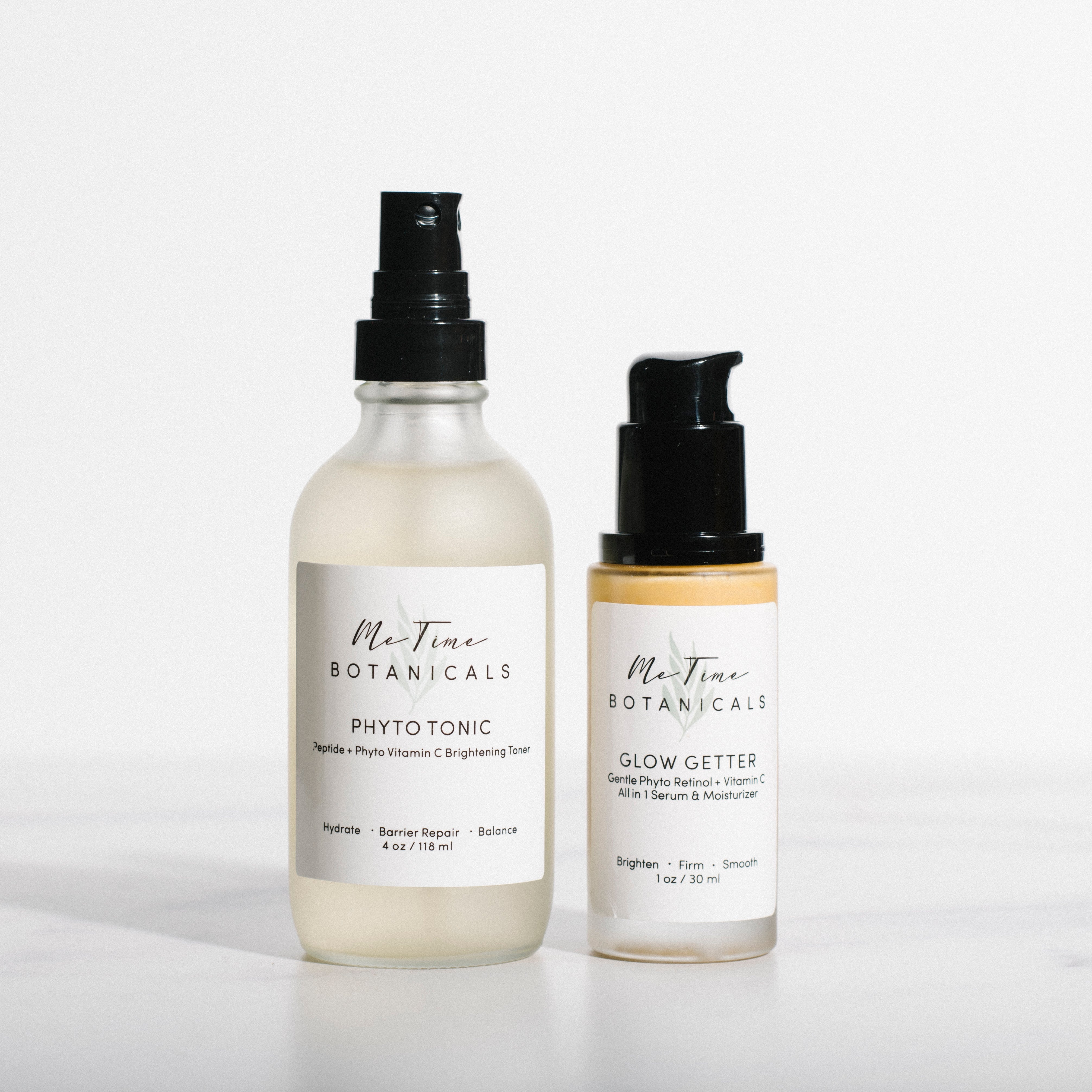 Two bottles of Mo Time Botanicals skincare products on a white background