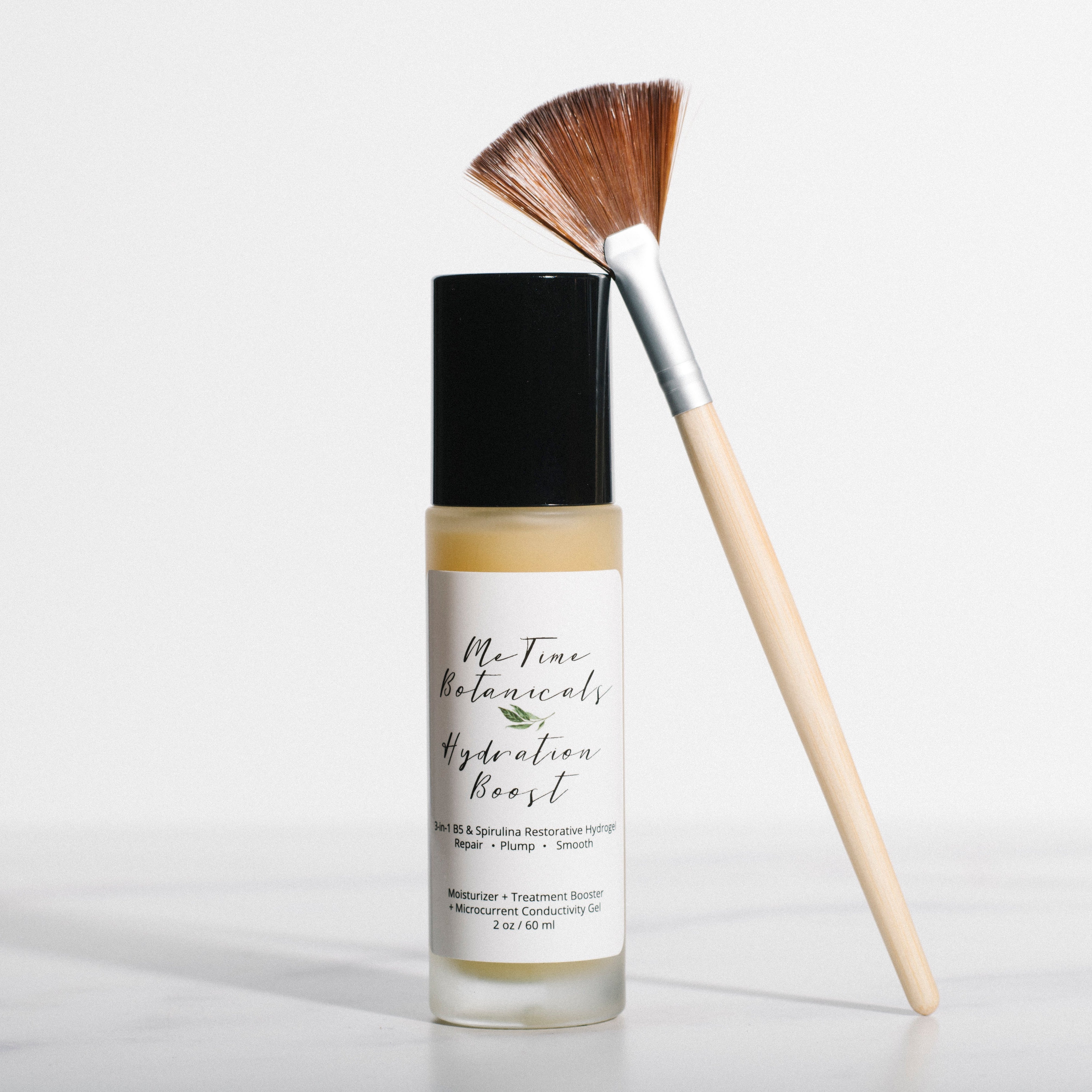 Skincare bottle with a brush on a white background