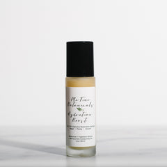 Skincare bottle with a black cap and white label on a light gray background