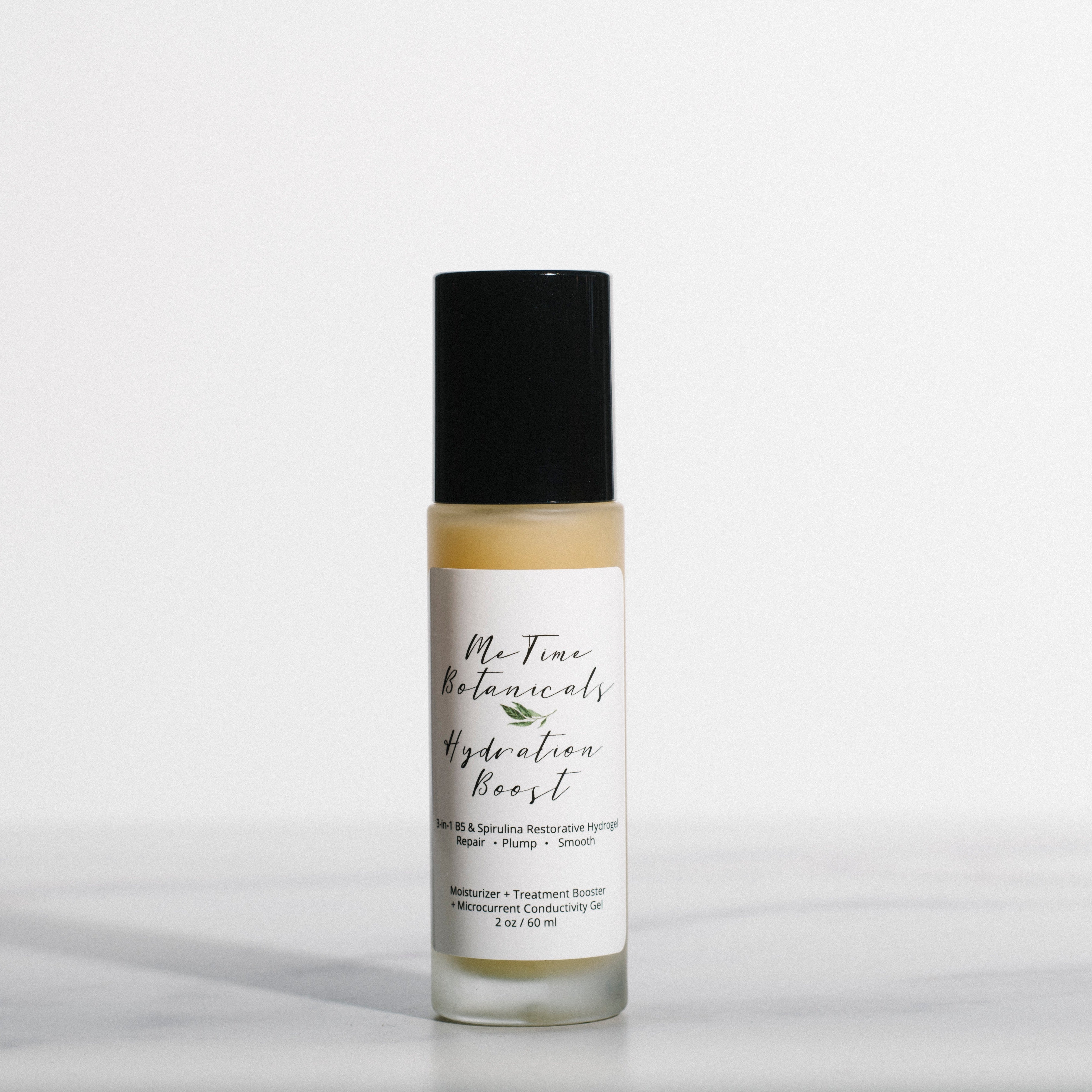Skincare bottle with a black cap and white label on a light gray background