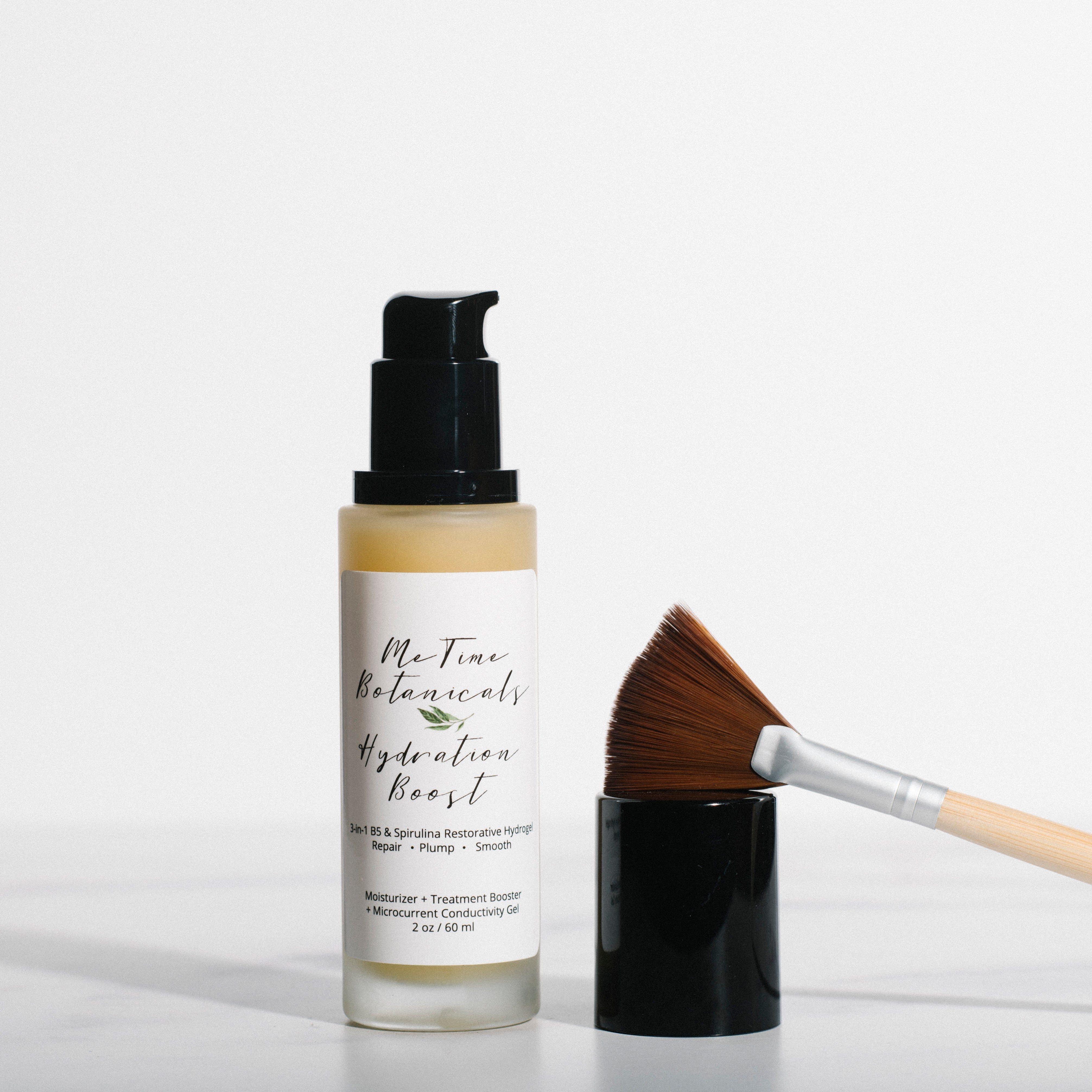 Skincare bottle with brush on a white background