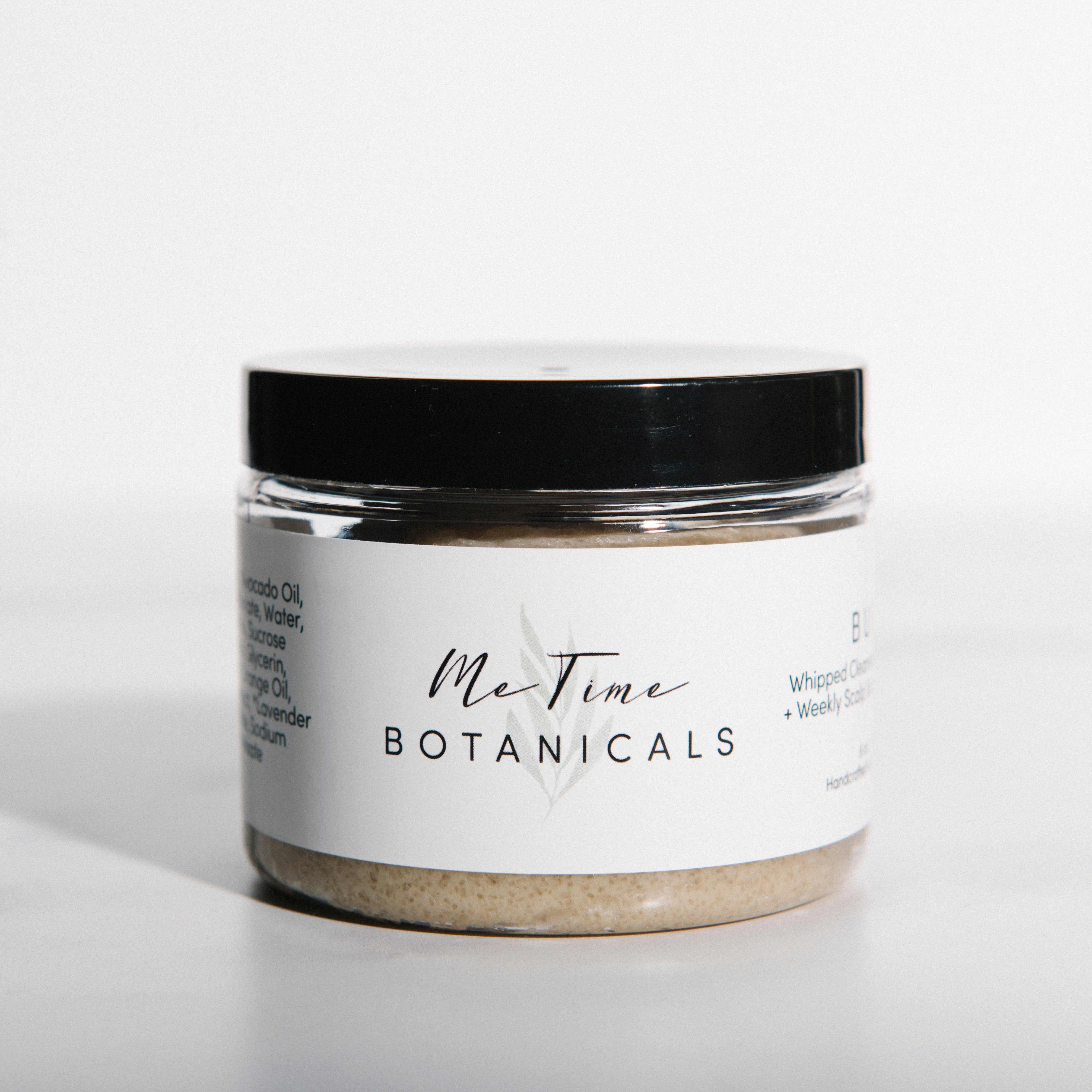 Jar of 'Me Time Botanicals' product on a white background