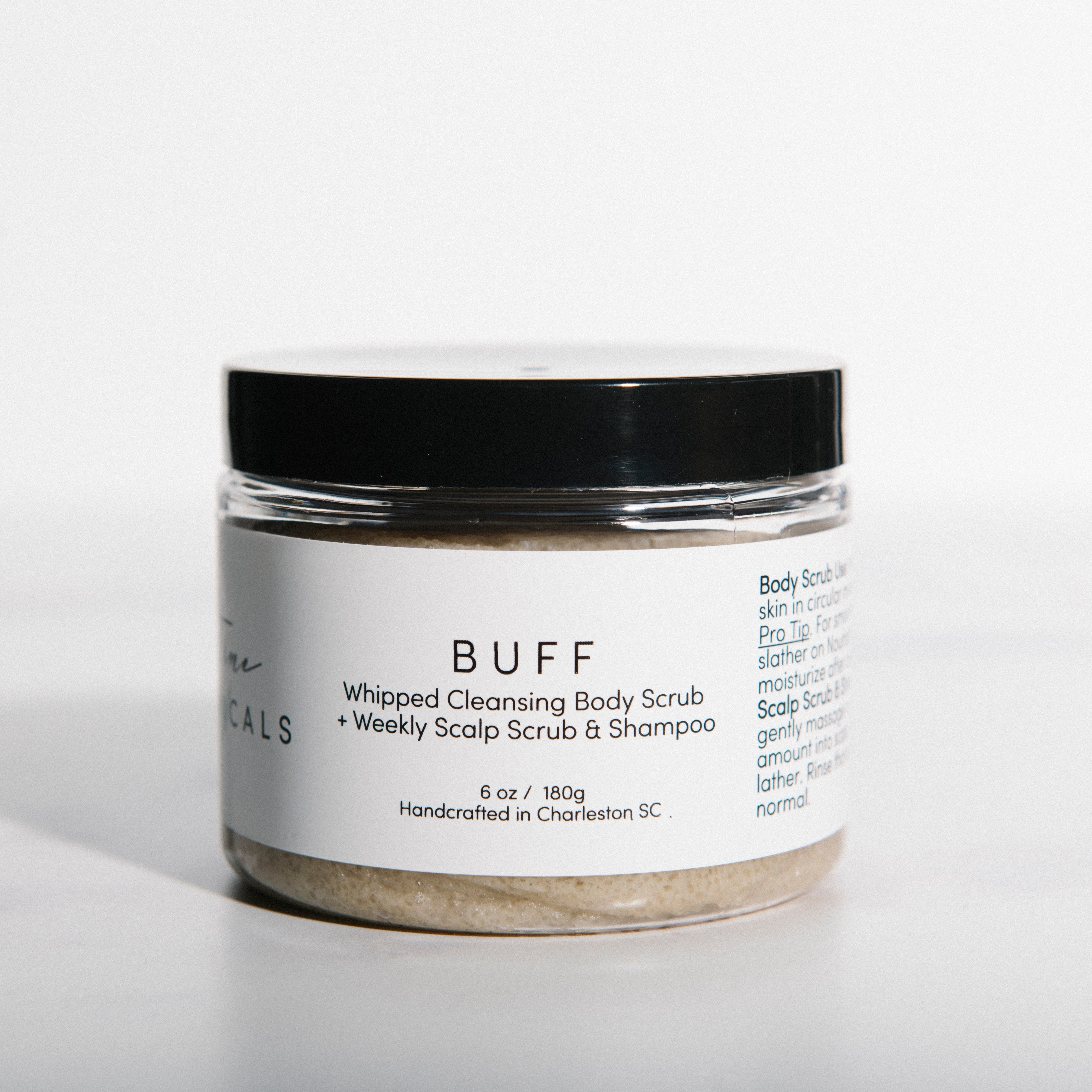 Jar of 'BUFF' body scrub with a white label on a white background