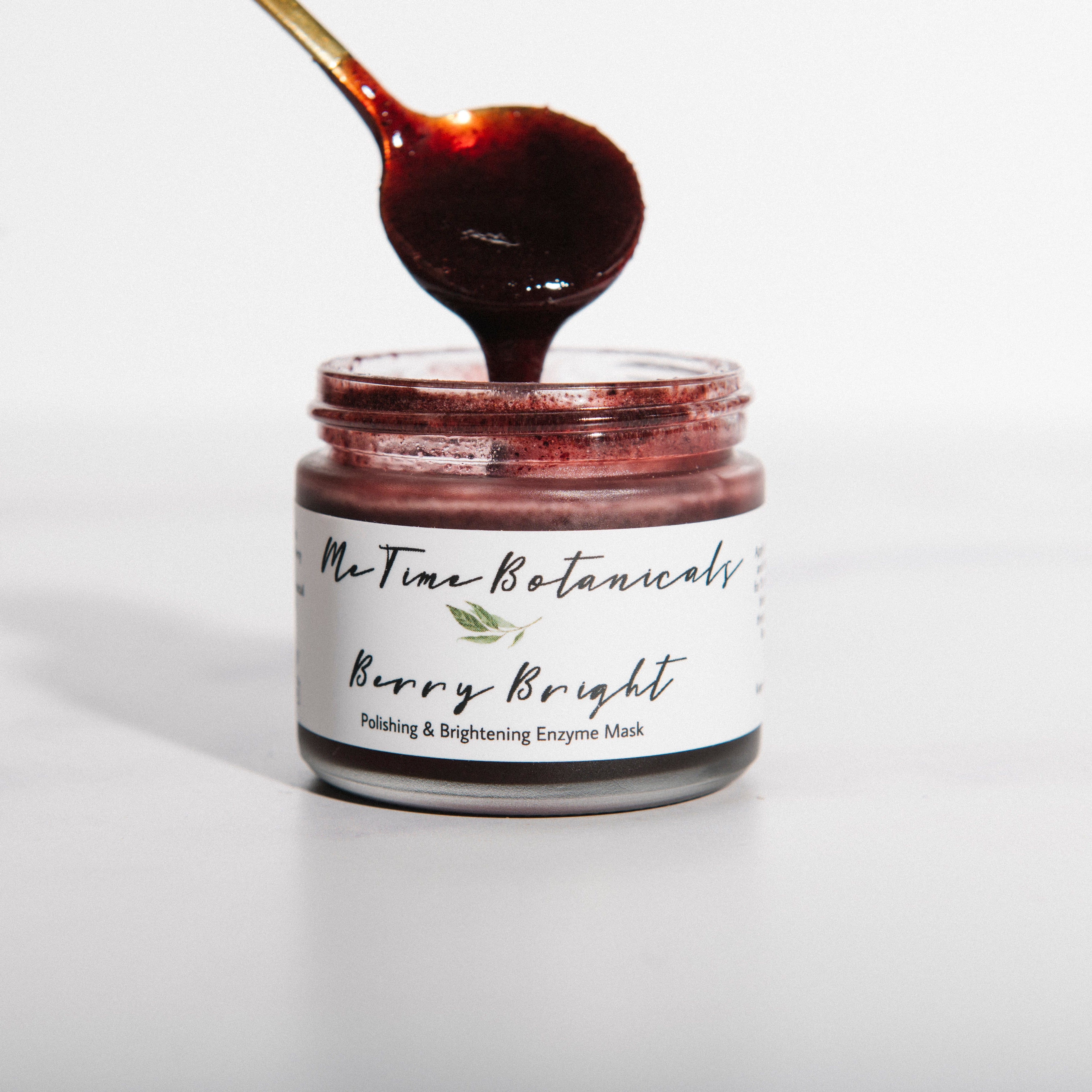 Jar of 'Rerry Bright' product with a spoon lifting some of the substance out, on a white background.