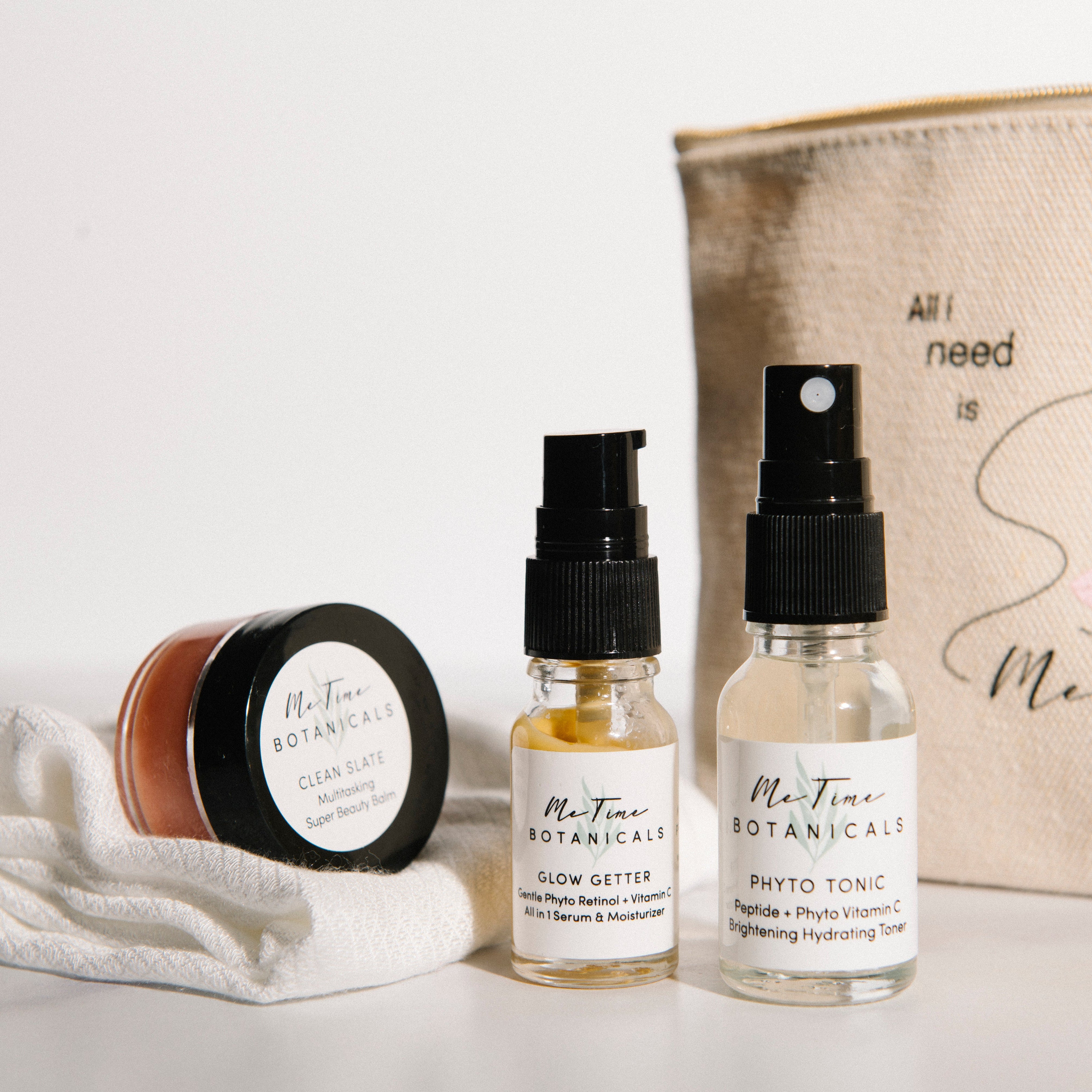 Skincare products and pouch with 'Me Time Botanicals' branding on a light background