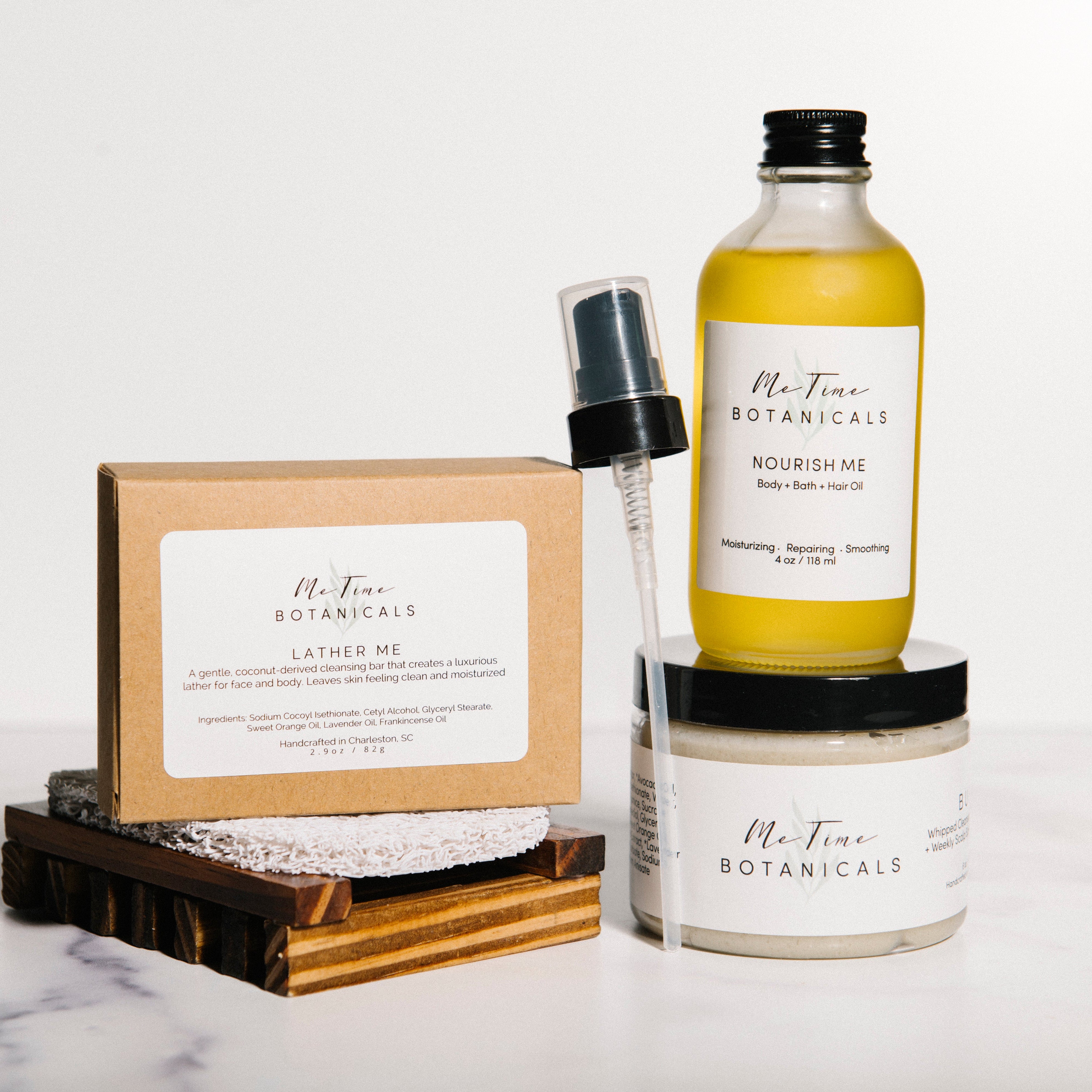 A set of Mt. Tine Botanicals skincare products arranged on a white marble surface against a white background.