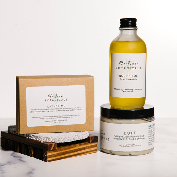 A set of Mt. Tine Botanicals skincare products arranged on a white marble surface against a white background.